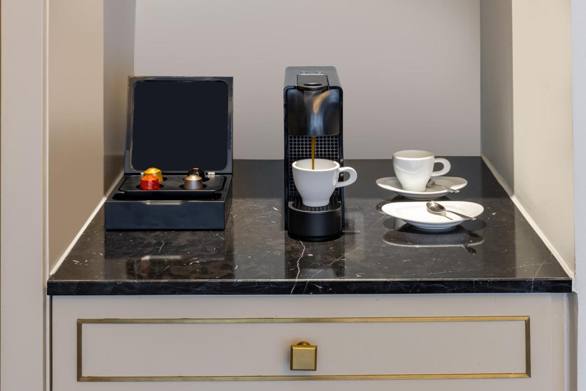 Melia Vinpearl Hue Hotel Luaran gambar A Nespresso coffee machine in a hotel room